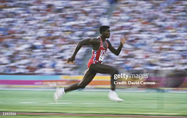 American athlete Carl Lewis accelerates down the runway as he competes in the Men's Long Jump event at the XXIII Olympic Summer Games at the Los...