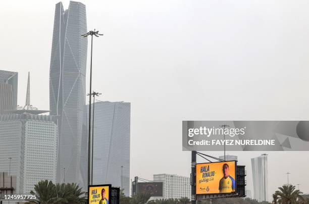 Billboard welcoming Saudi football club al-Nassr's new Portuguese forward Cristiano Ronaldo is displayed along a road in Saudi Arabia's capital...