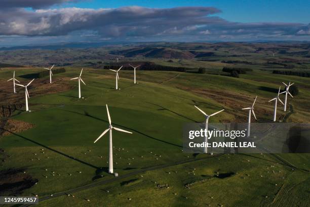 An aerial view shows wind turbines at an onshore wind farm in Llandinam, central Wales, on January 2, 2023.