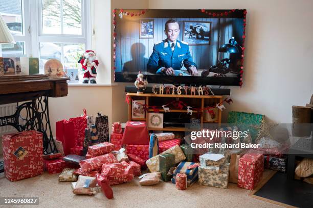 The Great Escape film is seen on a widescreen TV in a living room filled with presents on Christmas Day, on 25th December 2022, in Nailsea, England.
