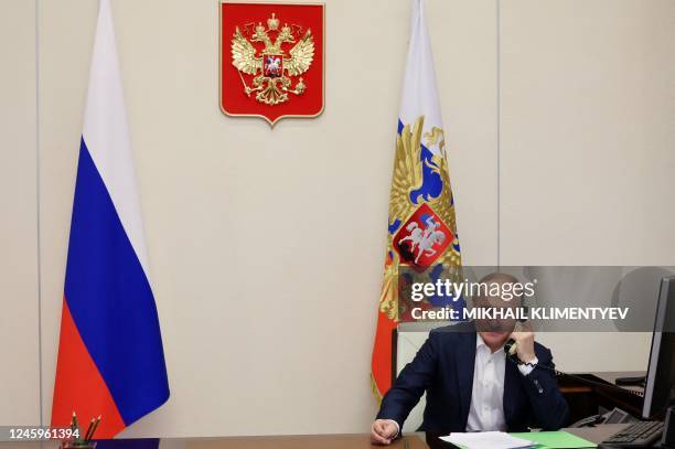 Russian President Vladimir Putin talks on the phone with Agatha Bylkova,a eight-year-old girl from the Kurgan region who took part in the New Year...