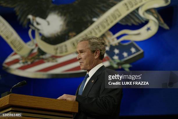 President George W. Bush smiles during the first debate of the 2004 White House race at the University of Miami in Coral Gables, near Miami, Florida,...