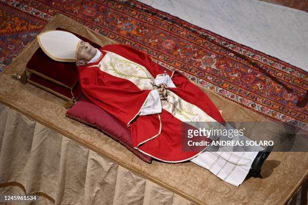 The body of Pope Emeritus Benedict XVI lies in state at St. Peter's Basilica in the Vatican, on January 3, 2023. - Benedict, a conservative...