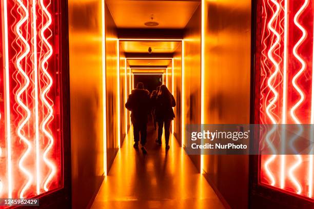 Group of people during a visit to the Guinness Storehouse in Dublin , a tourist attraction dedicated to the manufacturing process and history of...