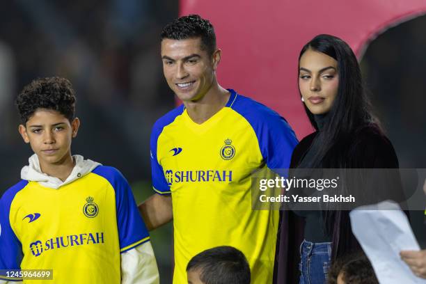 Cristiano Ronaldo accompanied by his partner Georgina Rodriguez and his son Cristiano Ronaldo Jr, greet the crowd during the official unveiling of...