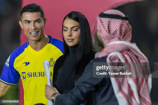 Cristiano Ronaldo accompanied by his partner Georgina Rodriguez greet the crowd during the official unveiling of Cristiano Ronaldo as an Al Nassr...