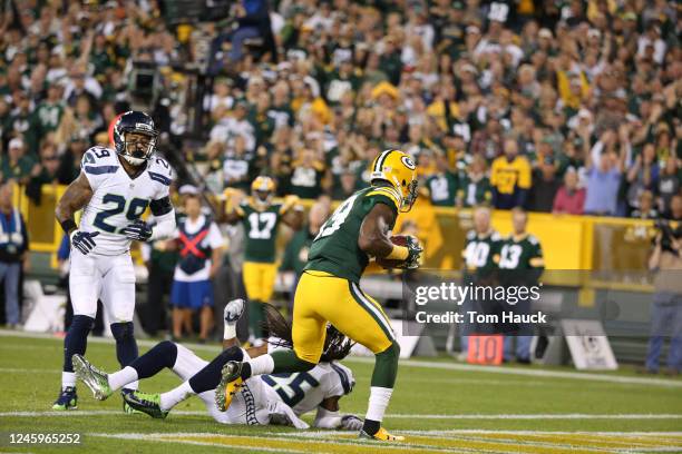 Green Bay Packers wide receiver James Jones gets tackled by Seattle Seahawks cornerback Richard Sherman during an NFL football game between the Green...