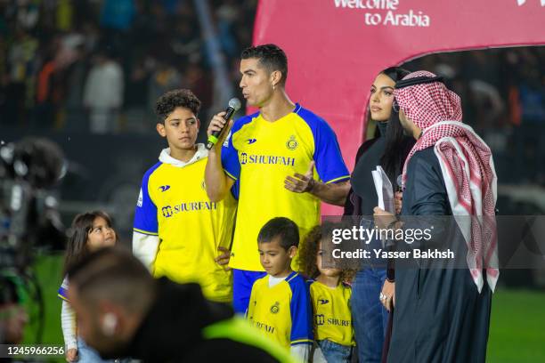 Cristiano Ronaldo accompanied by his partner Georgina Rodriguez and his son Cristiano Ronaldo Jr, greet the crowd during the official unveiling of...