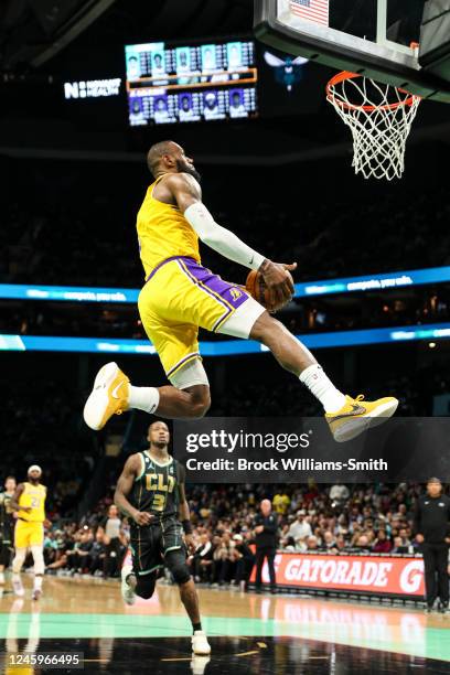 LeBron James of the Los Angeles Lakers dunks the ball against the Charlotte Hornets on January 2, 2023 at Spectrum Center in Charlotte, North...