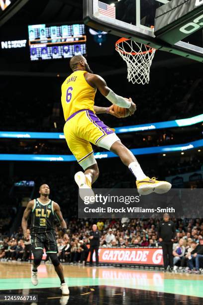 LeBron James of the Los Angeles Lakers dunks the ball against the Charlotte Hornets on January 2, 2023 at Spectrum Center in Charlotte, North...