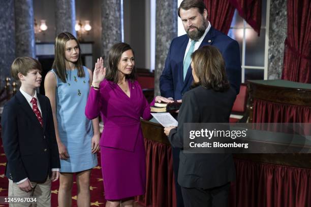 Vice President Kamala Harris, right, participates in a ceremonial swearing-in of Senator Katie Britt, a Republican from Alabama, center, at the Old...