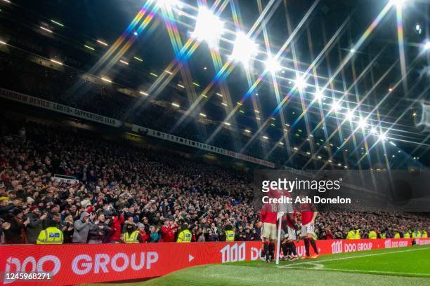Luke Shaw of Manchester United celebrates scoring a goal to make the score 2-0 with team-mates during the Premier League match between Manchester...