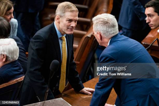 Rep. Jim Jordan, R-Ohio, left, and House Republican Leader Kevin McCarthy, R-Calif., talk on the House floor of the U.S. Capitol after a vote in...
