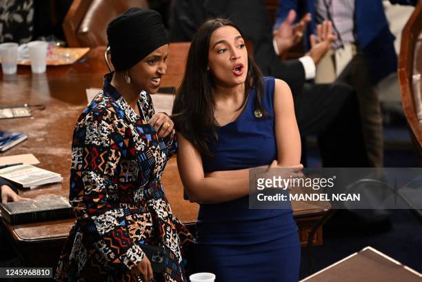 Democratic Representative from New York Alexandria Ocasio Cortez and Dempocratic Representative from Minnesota Ilhan Omar chat as the US House of...