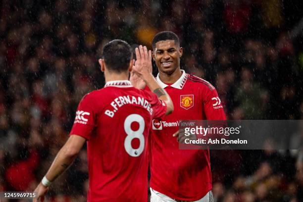 Marcus Rashford of Manchester United celebrates scoring a goal to make the score 3-0 with Bruno Fernandes of Manchester United during the Premier...