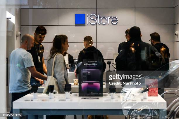 People are seen inside iStore in Tel Aviv, Israel on December 30, 2022.