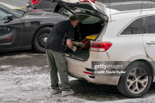 An investigator works at the site of a quadruple murder on January 3, 2023 in Moscow, Idaho. A suspect has been arrested for the murders of four...