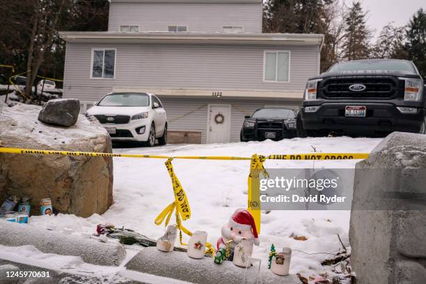 Objects left for a makeshift memorial sit at the site of a quadruple murder on January 3, 2023 in Moscow, Idaho. A suspect has been arrested for the...