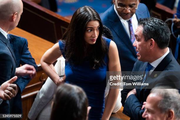 Reps. Alexandria Ocasio-Cortez, D-N.Y., and Pete Aguilar, D-Calif., are seen on the House floor of the U.S. Capitol after a vote in which House...
