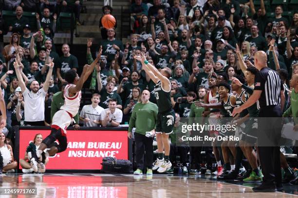 Steven Izzo of the Michigan State Spartans shoots a three-point basket during the second half against the Nebraska Cornhuskers at Breslin Center on...