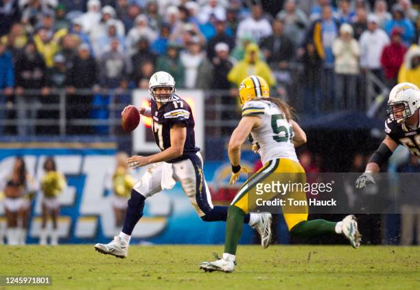 Phillip Rivers of the San Diego Chargers scrambles out to pass against the Green Bay Packers on November 6, 2011 at Qualcomm Stadium in San Diego,...