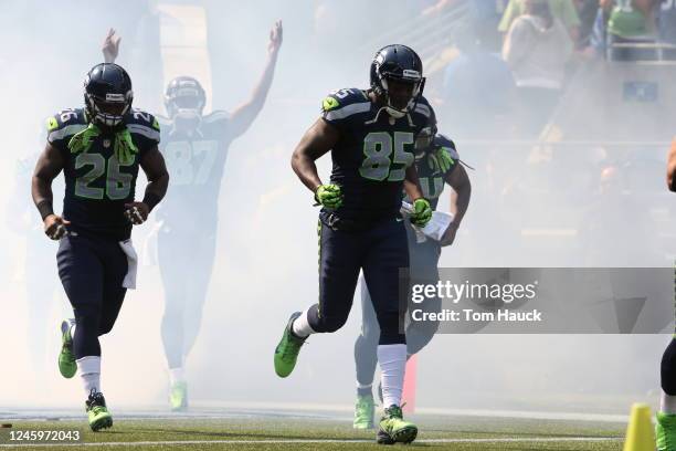 Seattle Seahawks tight end Anthony McCoy runs through the tunnel onto the field against the Dallas Cowboys during an NFL game in Seattle, Washington...