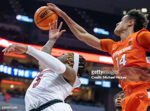 El Ellis of the Louisville Cardinals has his shot blocked by Jesse Edwards of the Syracuse Orange during the second half at KFC YUM! Center on...