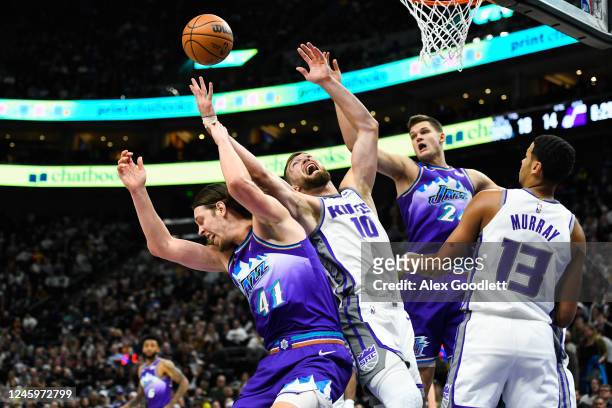 Kelly Olynyk of the Utah Jazz and Domantas Sabonis of the Sacramento Kings attempt a rebound during the first half of the game at Vivint Arena on...