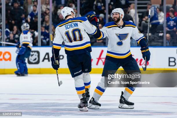 St. Louis Blues Winger Brayden Schenn celebrates the win with Defenceman Robert Bortuzzo after the NHL regular season game between the St. Louis...