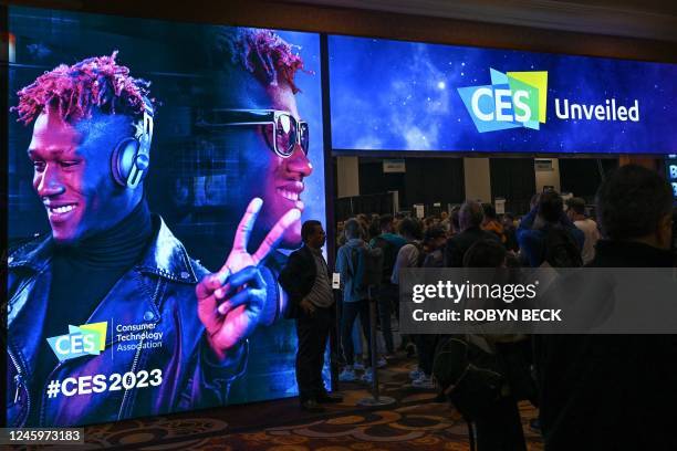 People arrive to attend CES Unveiled ahead of the Consumer Electronics Show on January 3, 2023 in Las Vegas, Nevada. - CES explores next-gen...