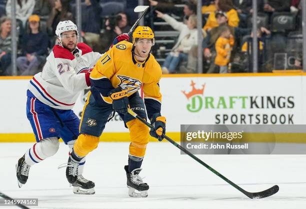 Mark Jankowski of the Nashville Predators skates against Jonathan Drouin of the Montreal Canadiens during an NHL game at Bridgestone Arena on January...