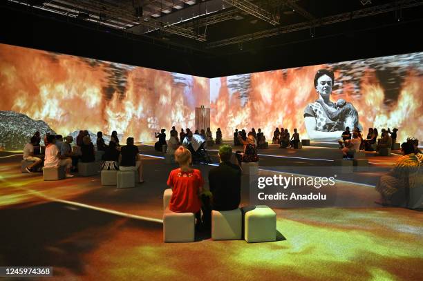 People watch projections during a media preview for exhibition, Frida Kahlo: The Life of an Icon, as part of Sydney Festival at the Cutaway in...