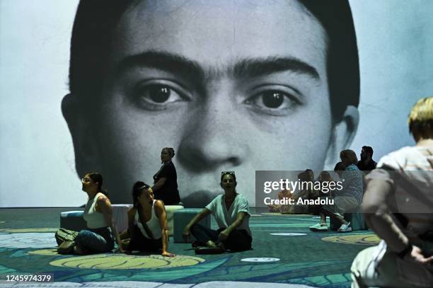 People watch projections during a media preview for exhibition, Frida Kahlo: The Life of an Icon, as part of Sydney Festival at the Cutaway in...