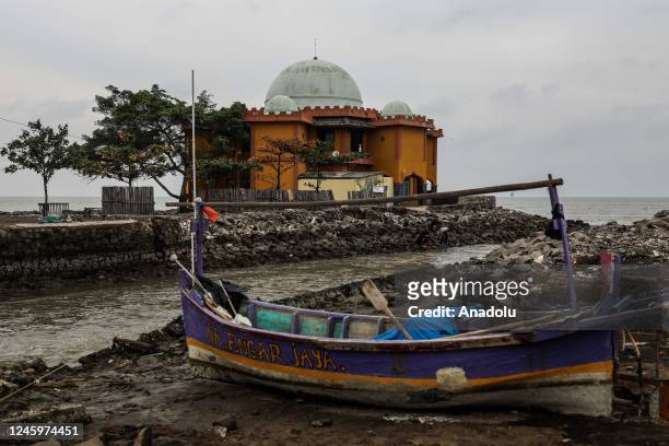 View of a mosque at a coast affected by abrasion at Cemarajaya Village of Karawang regency in West Java, Indonesia on January 03, 2023. The impact of...