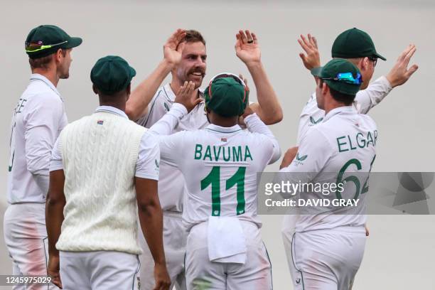 South Africa's Anrich Nortje celebrates with team mates after dismissing Australias Marnus Labuschagne during day one of the third cricket Test match...