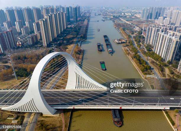Cargo ships sail on the Beijing-Hangzhou Grand Canal in Huaian, Jiangsu Province, China, Jan 4, 2023. According to the latest data from the Northern...