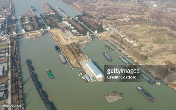 Cargo ships pass through Huaiyin Lock in Huai 'an, East China's Jiangsu province, Jan 4, 2023. According to the statistics of the North Jiangsu...