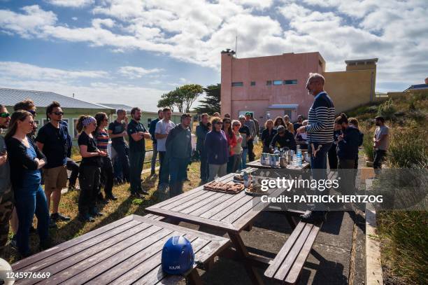 This photograph taken on December 29, 2022 shows chief of the Amsterdam district Jean-Philippe Branne speaking to new seasonal residents after...