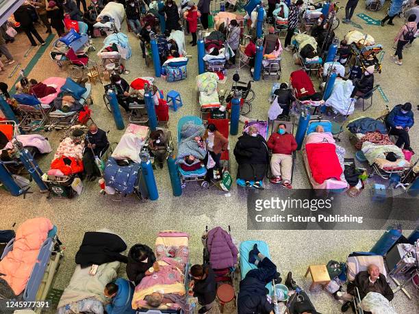 Patients, mostly aged people with Covid symptoms, overwhelm the hall of a building at Changhai Hospital in Shanghai, China Tuesday, Jan. 03, 2023.