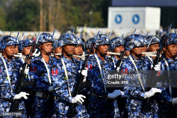 Members of the Myanmar military march at a parade ground to mark the country's Independence Day in Naypyidaw on January 4, 2023. - Myanmar's junta...