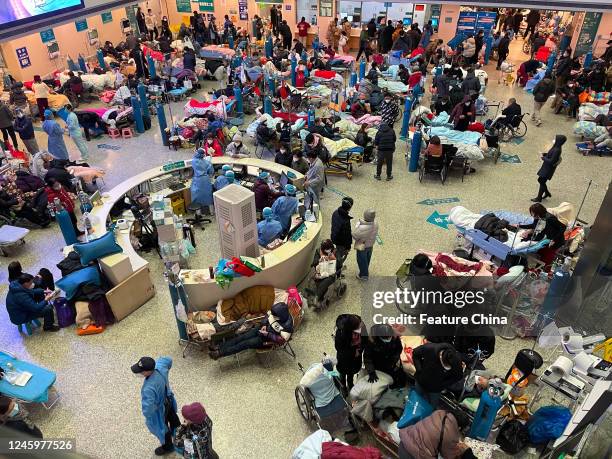 Patients, mostly aged people with Covid symptoms, overwhelm the hall of a building at Changhai Hospital in Shanghai, China Tuesday, Jan. 03, 2023.