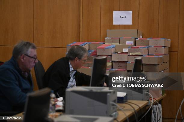 Volunteers work on documents for postal voting as preparations are under way for repeated elections, on January 4, 2023 in Berlin. - Repeated Berlin...