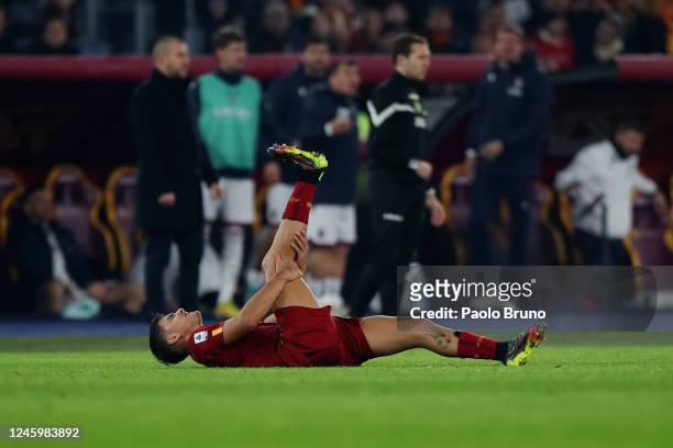Paulo Dybala of AS Roma is injured during the Serie A match between AS Roma and Bologna FC at Stadio Olimpico on January 4, 2023 in Rome, Italy.