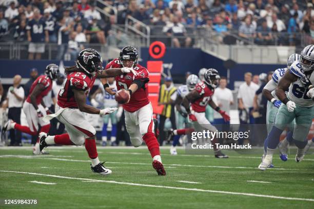 Atlanta Falcons quarterback Matt Ryan passing ball to teammate Atlanta Falcons running back Devonta Freeman during an NFL football game between the...