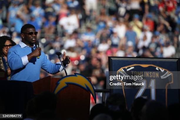 LaDainian Tomlinson former running back of the San Diego Chargers has his jersey retired during an NFL football game between the Kansas City Chiefs...
