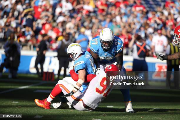 San Diego Chargers quarterback Philip Rivers and Kansas City Chiefs outside linebacker Tamba Hali in action during an NFL football game between the...