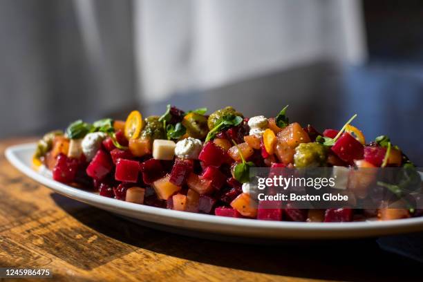 Cambridge, MA Ensalada de Remolacha at Gustazo Cuban Kitchen & Bar. Beets, Roasted heirloom beets, queso fresco, tarragon-hazelnut pesto, yogurt,...