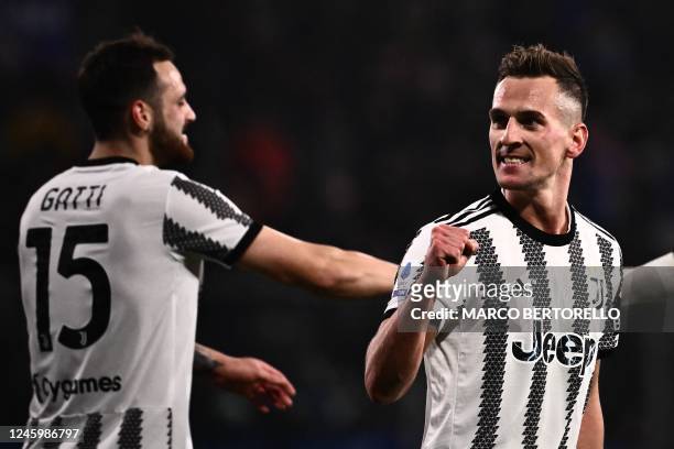 Juventus' Polish forward Arkadiusz Milik celebrates after opening the scoring during the Italian Serie A football match between Cremonese and...