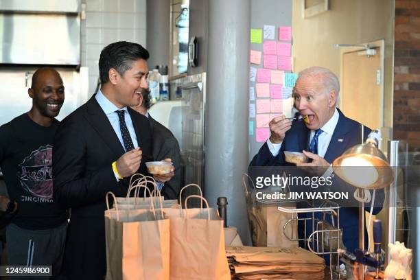 President Joe Biden samples peach cobbler with Cincinnati mayor Aftab Pureval at Just Q'in barbecue restaurant in Cincinnati, Ohio,, on January 4,...