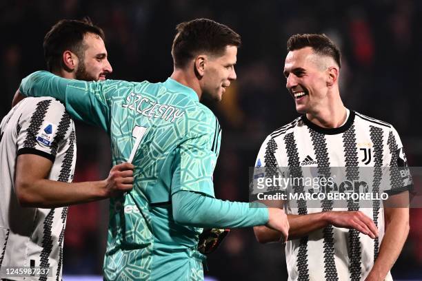 Juventus' Italian defender Federico Gatti, Juventus' Polish goalkeeper Wojciech Szczesny and Juventus' Polish forward Arkadiusz Milik celebrate at...